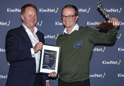 Kevin Sheehy and host with his award