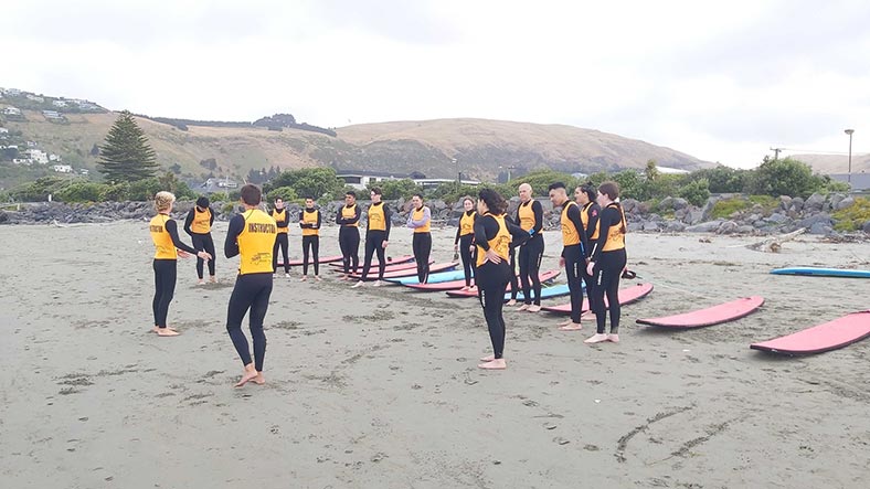 DiscoveryCamp 2023 students attend Surf School at Sumner Beach in Christchurch